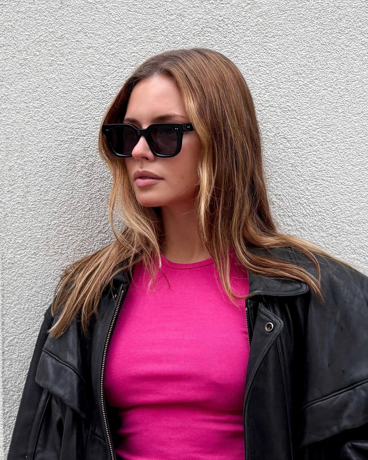 Woman in bold black sunglasses — tinted world